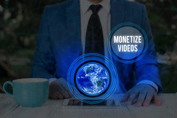 Handwriting text writing Monetize Videos. Concept meaning process of earning money from your uploaded YouTube videos Elements of this image furnished by NASA. — Stock Photo, Image