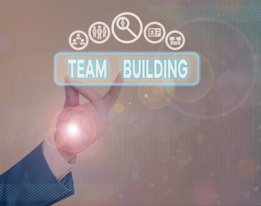 Writing note showing Team Building. Business photo showcasing activities designed to increase motivation and cooperation.