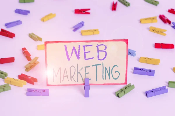 Writing note showing Web Marketing. Business photo showcasing The process of using the Internet to market the business Colored clothespin papers empty reminder white floor background office. — Zdjęcie stockowe