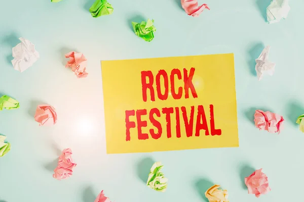 Conceptual hand writing showing Rock Festival. Business photo text Largescale rock music concert featuring heavy metals genre Colored clothespin rectangle shaped paper blue background. — 스톡 사진