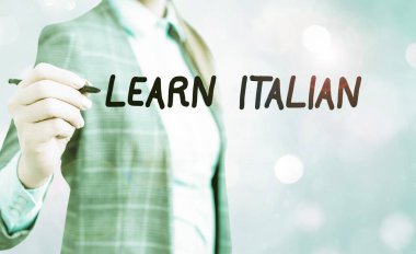 Conceptual hand writing showing Learn Italian. Business photo showcasing gain or acquire knowledge of speaking and writing Italian.