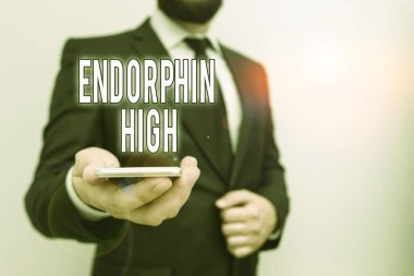 Handwriting text Endorphin High. Concept meaning trigger a positive feeling in the body like that of morphine Male human wear formal work suit hold smart hi tech smartphone use one hand. clipart