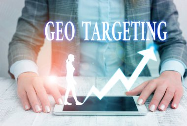 Writing note showing Geo Targeting. Business photo showcasing method of determining the geolocation of a website visitor.