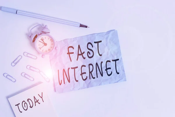 Handwriting text writing Fast Internet. Concept meaning term used for Internet service that is faster than the average Alarm clock clips notepad blank crushed sheet marker sky colored background. — Stockfoto
