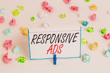 Word writing text Responsive Ads. Business concept for Automatically adjust form and format to fit existing ad space Colored crumpled papers empty reminder white floor background clothespin.