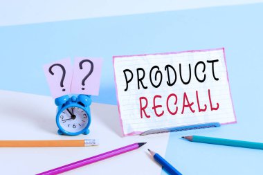 Text sign showing Product Recall. Conceptual photo process of retrieving potentially unsafe goods from consumers Mini size alarm clock beside stationary placed tilted on pastel backdrop.