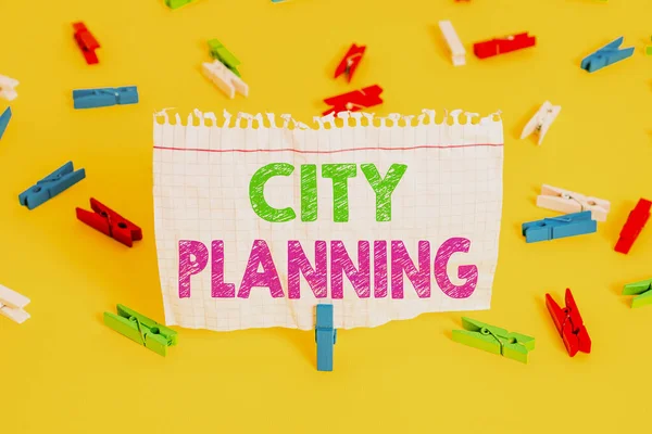 Word writing text City Planning. Business concept for the planning and control of the development of a town Colored clothespin papers empty reminder yellow floor background office.