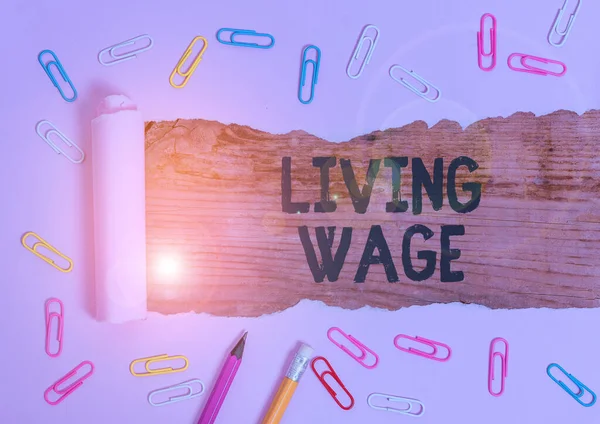 Text sign showing Living Wage. Conceptual photo wage that is high enough to maintain a normal standard of living.