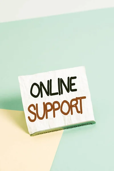 Writing note showing Online Support. Business photo showcasing electronic usually webbased version of customer service Paper on buffer wire on soft pastel multi colours backdrop. — ストック写真