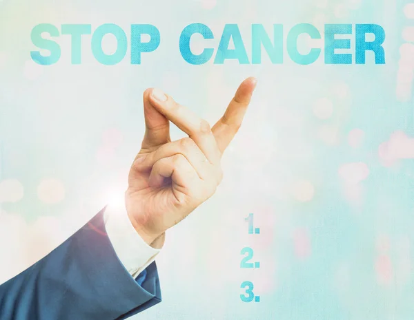Writing note showing Stop Cancer. Business photo showcasing prevent the uncontrolled growth of abnormal cells in the body.