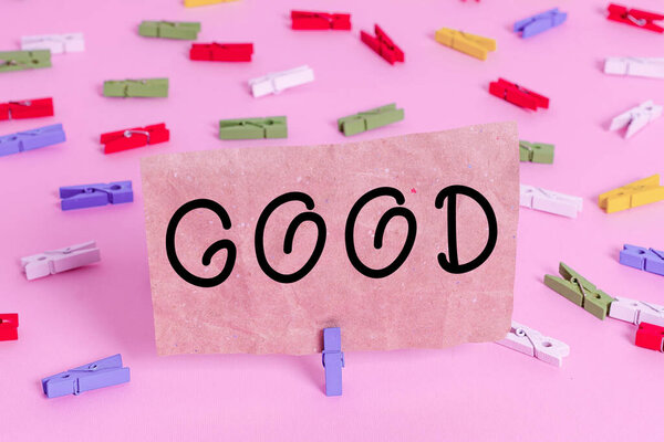 Conceptual hand writing showing Good. Business photo text Appropriate to a certain purpose Expressing approval showing kindness Colored clothespin papers empty reminder pink floor office pin.