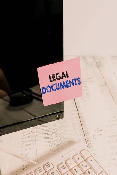 Conceptual hand writing showing Legal Documents. Business photo showcasing a document concerning a legal matter Drawn up by a lawyer Notation paper computer monitor screen near white keyboard. — Stock Photo, Image