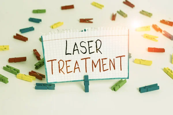 Text sign showing Laser Treatment. Conceptual photo any of various medical and surgical techniques using lasers Colored clothespin papers empty reminder white floor background office.