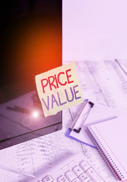 Writing note showing Price Value. Business photo showcasing the price of a product based on what customers think or valued Note paper taped to black computer screen near keyboard and stationary.