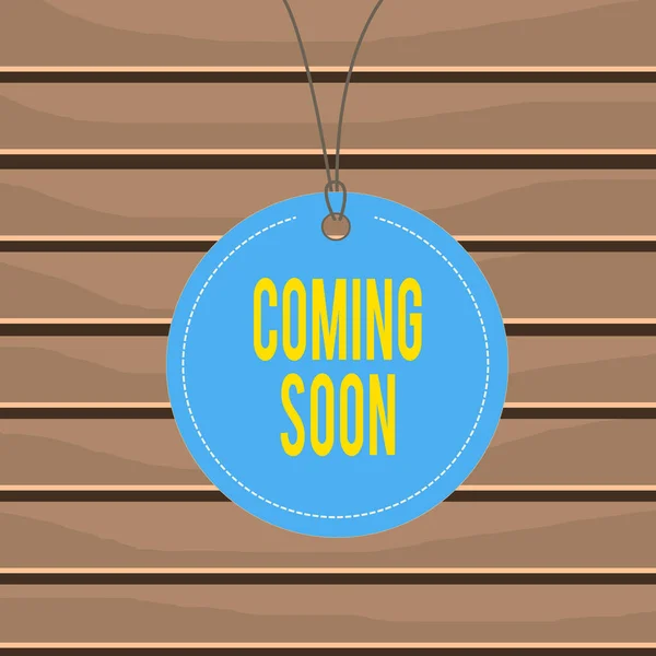 Conceptual hand writing showing Coming Soon. Business photo text something is going to happen soon or after a short time Label string round empty tag colorful background small shape. — Stok fotoğraf