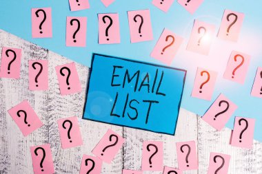 Text sign showing Email List. Conceptual photo widespread distribution of information to many Internet users Scribbled and crumbling papers with thick cardboard above wooden table.