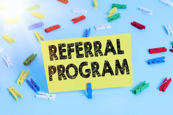 Text sign showing Referral Program. Conceptual photo internal recruitment method employed by organizations Colored clothespin papers empty reminder blue floor background office pin.
