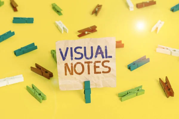 Handwriting text Visual Notes. Concept meaning process of representing ideas nonlinguistically Sketchnoting Colored clothespin papers empty reminder yellow floor background office. — Φωτογραφία Αρχείου