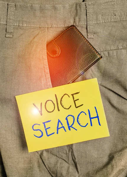 Writing note showing Voice Search. Business photo showcasing allows the user to use a voice command to search the Internet Small wallet inside trouser front pocket near notation paper.