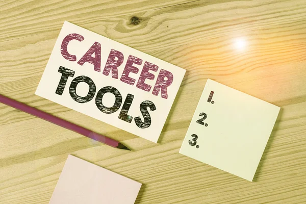 Text sign showing Career Tools. Conceptual photo the system designed to assist and enhance your career Colored clothespin papers empty reminder wooden floor background office.