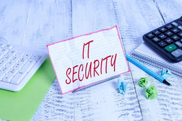 Handwriting text It Security. Concept meaning protection of data or digital asset against unauthorized access Notepaper stand on buffer wire in between computer keyboard and math sheets. — Stok fotoğraf