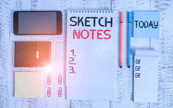 Word writing text Sketch Notes. Business concept for visual notetaking Combination of notetaking and doodling Smartphone wallet sticky notes clips notebook pens note pad wooden table. — ストック写真