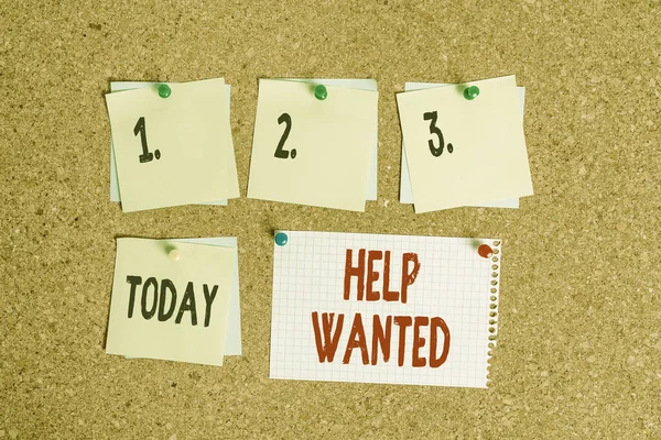 Writing note showing Help Wanted. Business photo showcasing An ad in the paper an employer places to find a new employee Corkboard size paper thumbtack sheet billboard notice board.