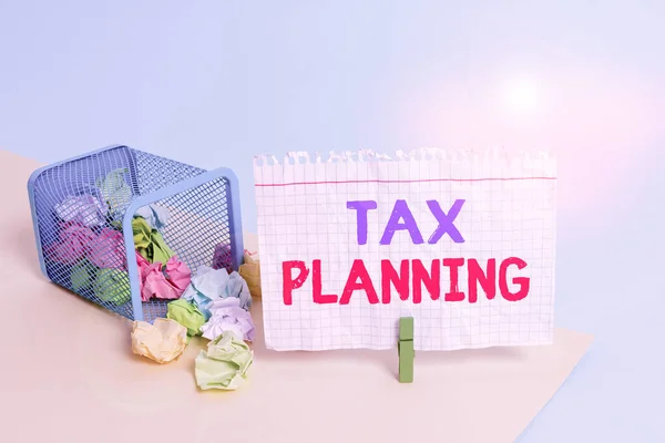 Handwriting text writing Tax Planning. Concept meaning man of financial situation or plan from a tax perspective Trash bin crumpled paper clothespin empty reminder office supplies tipped.
