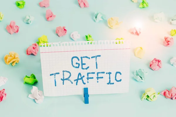 Conceptual hand writing showing Get Traffic. Business photo showcasing amount of data sent and received by visitors to a website Colored crumpled papers empty reminder blue floor clothespin.