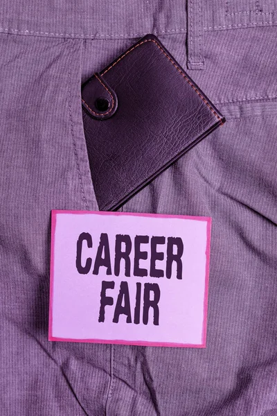 Text sign showing Career Fair. Conceptual photo an event at which job seekers can meet possible employers Small little wallet inside man trousers front pocket near notation paper.