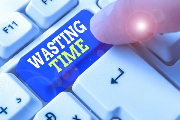 Text sign showing Wasting Time. Conceptual photo act of spending time doing something that is unnecessary.