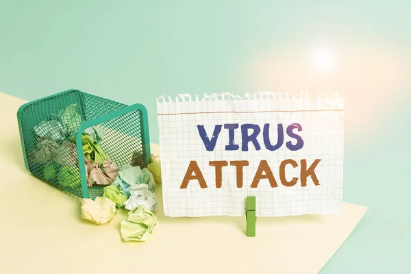 Handwriting text writing Virus Attack. Concept meaning malicious program that perform actions unauthorized by the user Trash bin crumpled paper clothespin empty reminder office supplies tipped.