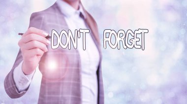 Writing note showing Don T Forget. Business photo showcasing used to remind someone about an important fact or detail.