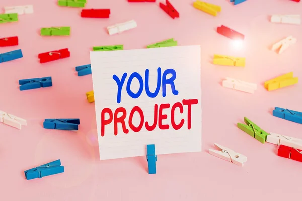 Word writing text Your Project. Business concept for series of tasks that need to be completed to reach an outcome Colored clothespin papers empty reminder pink floor background office pin.