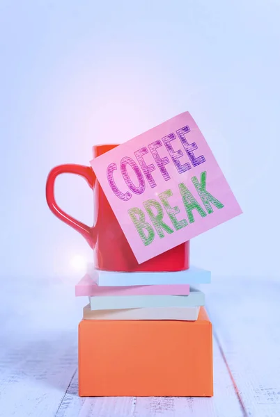 Text sign showing Coffee Break. Conceptual photo short time when you stop working to have a cup of coffee Coffee cup blank sticky note stacked note pads square box wooden table. — 스톡 사진