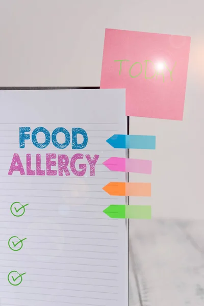 Writing note showing Food Allergy. Business photo showcasing an abnormal immune response after eating a certain food Hard cover note book sticky note arrow banner inserted clear background.