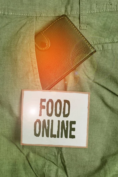 Signo de texto que muestra Food Online. Foto conceptual la manera más conveniente para que los clientes compren comida en línea Pequeña billetera dentro de los pantalones del hombre bolsillo delantero cerca del papel de la notación . — Foto de Stock