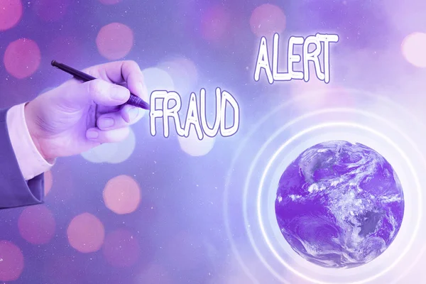 Conceptual hand writing showing Fraud Alert. Business photo text security alert placed on credit card account for stolen identity Elements of this image furnished by NASA.
