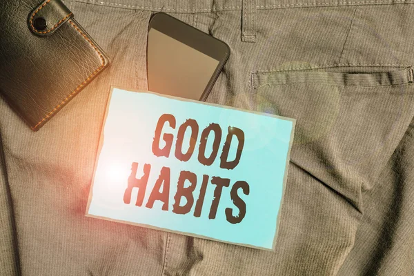 Handschrift tekst schrijven Good Habits. Concept betekent gedrag dat gunstig is voor je s is fysieke of geestelijke gezondheid Smartphone apparaat in broek voorzak met portemonnee en nota papier. — Stockfoto