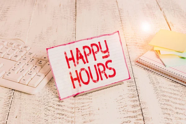 Handwriting text writing Happy Hours. Concept meaning when drinks are sold at reduced prices in a bar or restaurant Notepaper stand on buffer wire in between computer keyboard and math sheets. — Stock Photo, Image