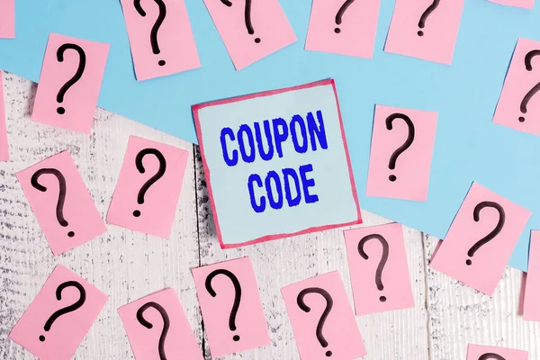 Conceptual hand writing showing Coupon Code. Business photo showcasing ticket or document that can be redeemed for a financial discount Crumbling papers with thick cardboard on the wooden table. — Stock Photo, Image