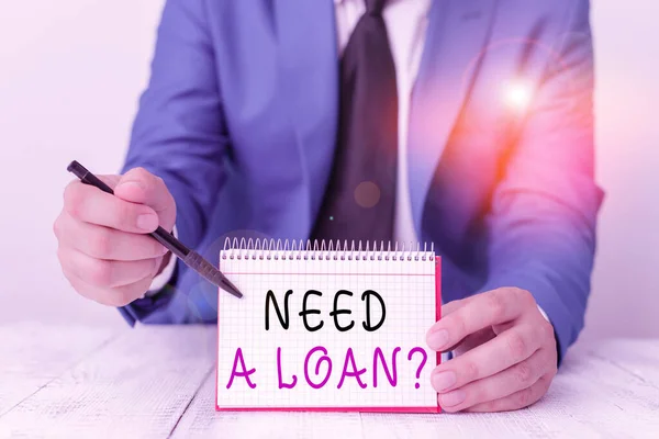 Handwriting text writing Need A Loan Question. Concept meaning asking he need money expected paid back with interest Man holds empty paper with copy space in front of him Space. — Stock Photo, Image