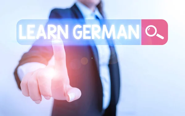 Handwriting text Learn German. Concept meaning get knowledge or skill in speaking and writing German language.