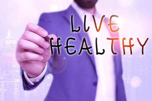 Текст почерка Live Healthy. Концепция, которая помогает сохранить и улучшить показатели здоровья или состояния . — стоковое фото