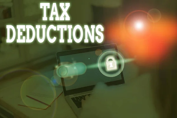 Πινακίδα κειμένου που εμφανίζει εκπτώσεις φόρου. Εννοιολογικό εισόδημα μείωσης των φωτογραφιών που μπορεί να φορολογηθεί για τα έξοδα. — Φωτογραφία Αρχείου