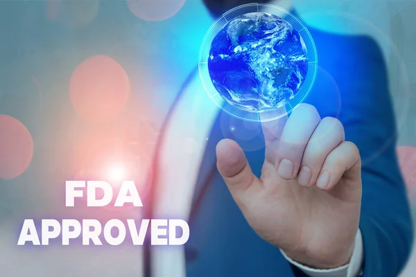 Signo de texto que muestra Fda Approved. Foto conceptual La FDA acordó que el producto o fórmula es segura y / o efectiva Elementos de esta imagen proporcionados por la NASA . — Foto de Stock