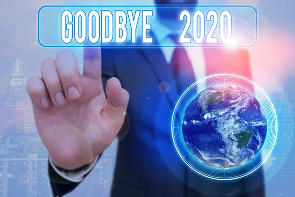 Writing note showing Good Bye 2020. Business photo showcasing express good wishes when parting or at the end of last year Elements of this image furnished by NASA. — Stock Photo, Image