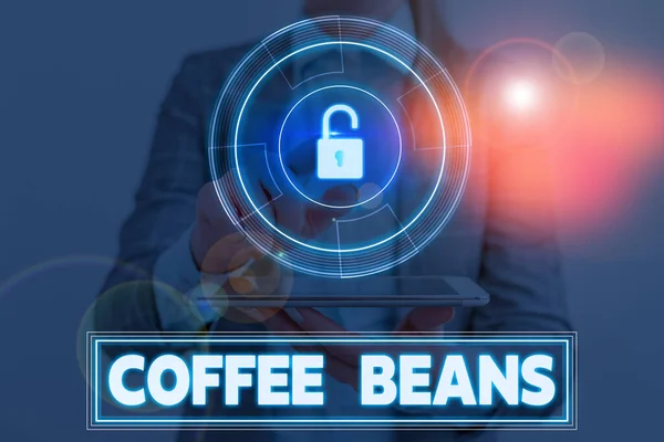 Konceptuální rukopis zobrazující kávová zrna. Obchodní fotografie předvádění jámy uvnitř červené nebo fialové ovoce často označované jako třešeň. — Stock fotografie