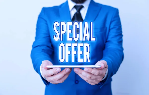 Word writing text Special Offer. Business concept for product or service that is offered free or at a very low price Businessman in blue suite with a tie holds lap top in hands.