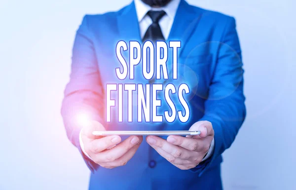 Tekst schrijven Sport Fitness. Business concept voor Conditionering atleten voor de unieke eisen van hun sport Zakenman in blauwe suite met een stropdas houdt schoot top in handen. — Stockfoto